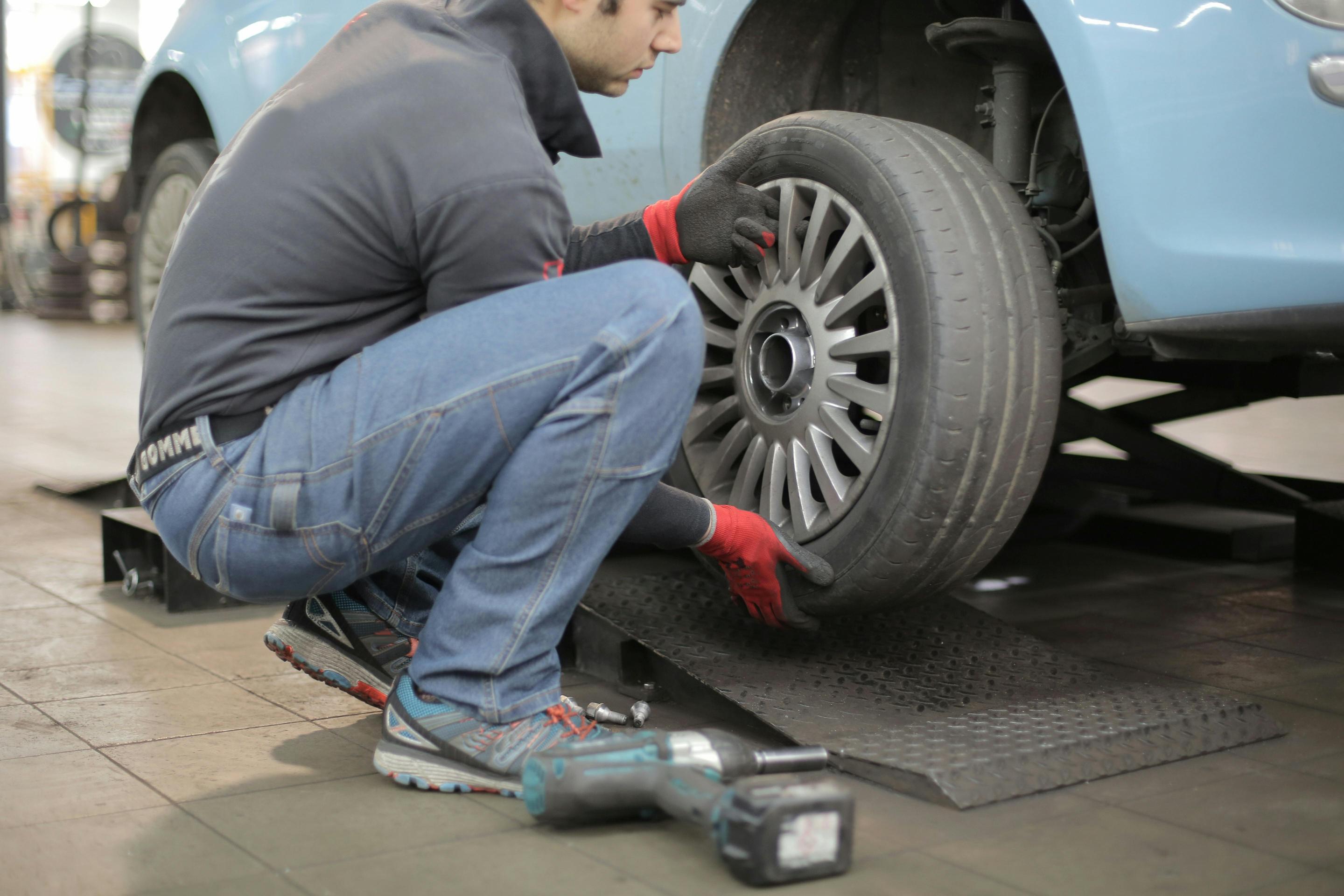 man replacing tires